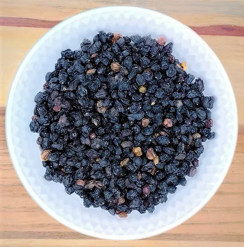 A picture of our organic elderberries which can be used in dishes like pies, wines and jams.